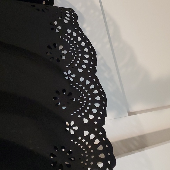 Off shoulder short dress with eyelett cutouts at bottom.  Black size 1XL - Picture 2 of 3